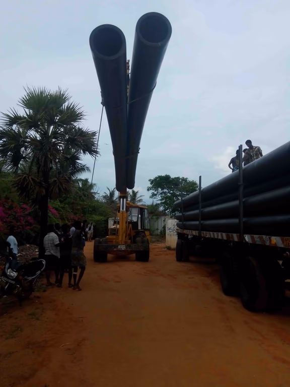 Unloading pipes to transport water from the site of the desalination plant to Auroville