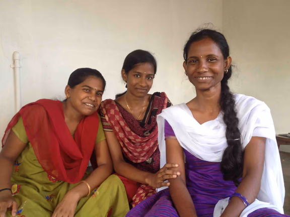 Reach for the Stars scholarship students (from left) Savithri and Suchithra, with graduate vaidegi