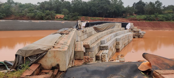 The ‘Lego block’ wall between sections 1 and 2 of the Matrimandir Lake broke in the middle and at the banks