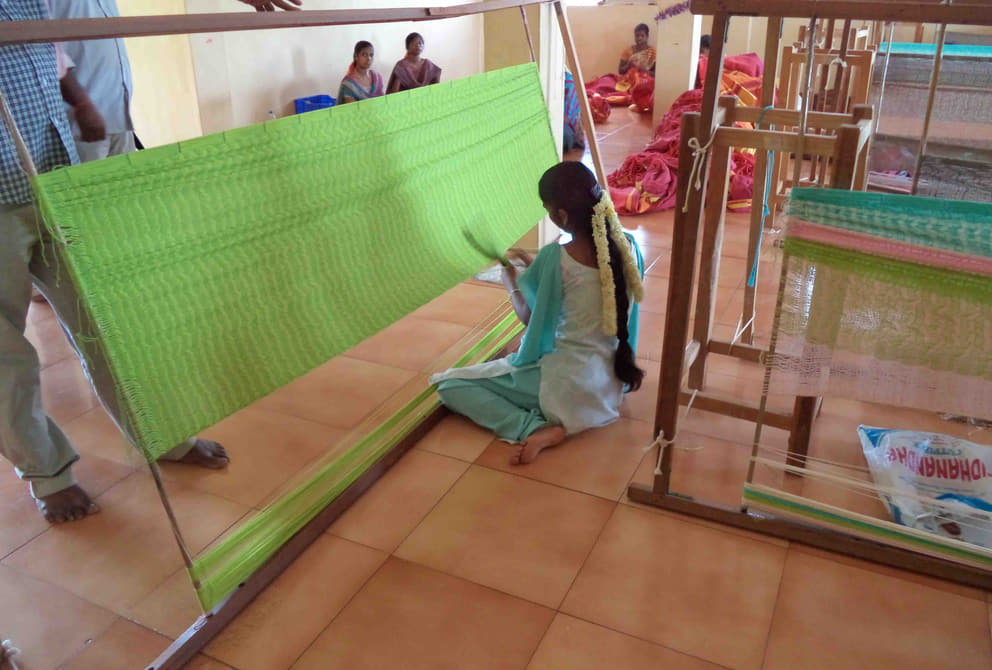 Women receiving training at an Auroville hammock making unit in Kottakarai