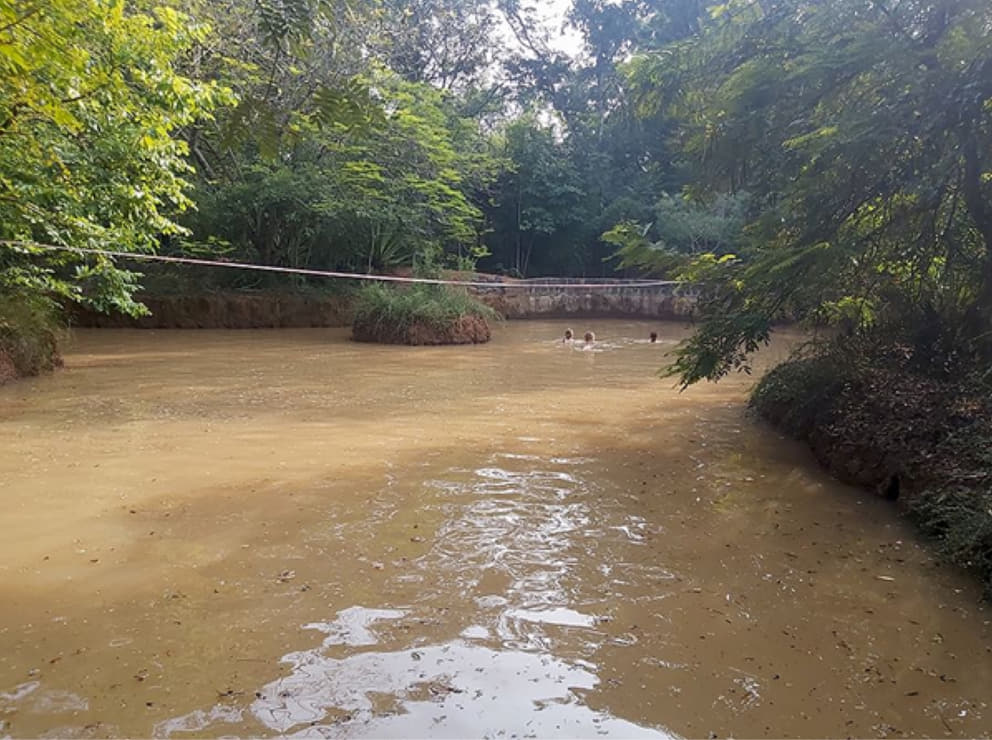1 Children swimming in a now destroyed water catchment pond in Darkali
