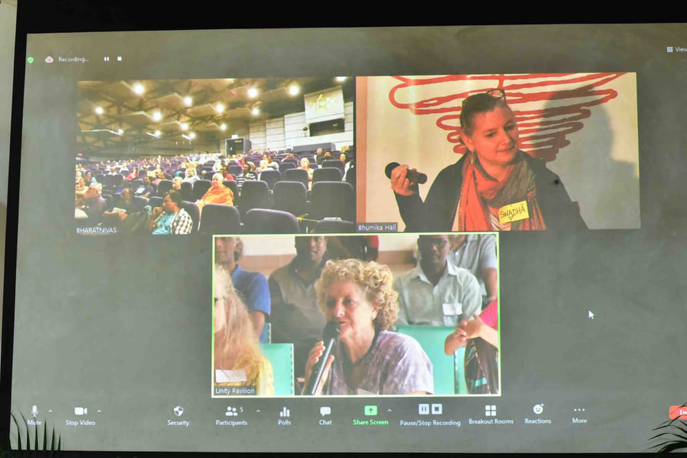 The happenings at each of the three venues could be viewed at each venue simultaneously. Top: The Bharat Nivas auditorium (left); a participant in the Bhumika hall making a presentation