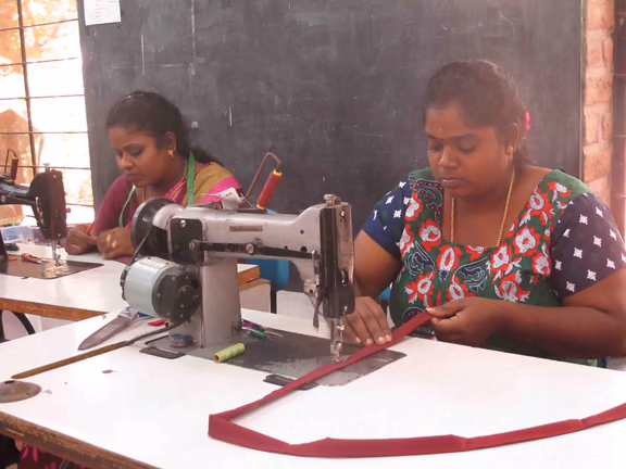 Women learning tailoring
