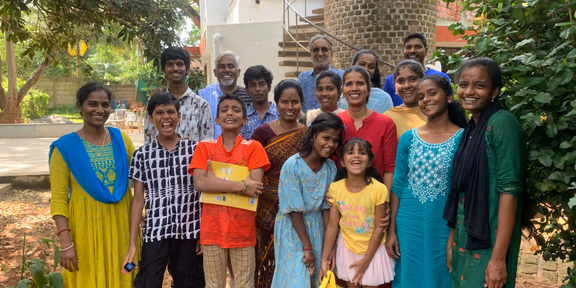 The Malarchi children, helpers and caretakers celebrating Christmas in 2024.  Tixon is second from left in the back row; Vanitha is fourth from right in the middle row