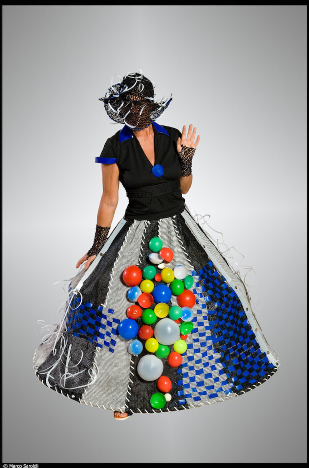 Arlet in a shade-net hoopskirt volumtsed made festive with reclaimed children's beach balls