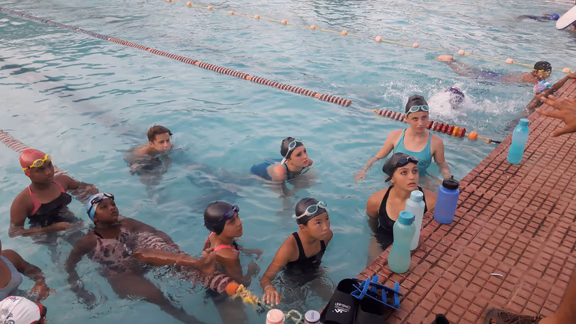 Auroville swimmers paying attention to the instructions