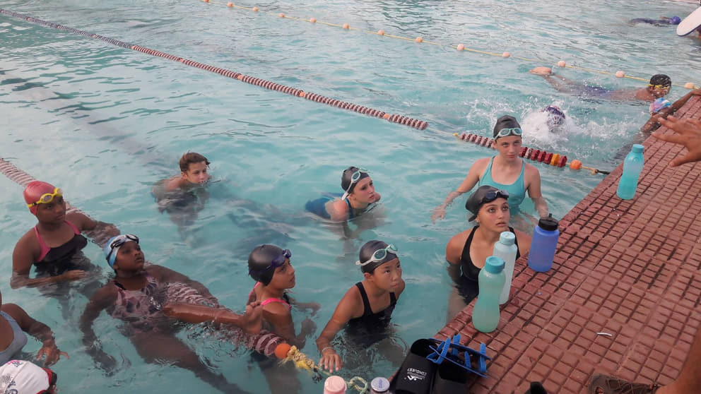 Auroville swimmers paying attention to the instructions