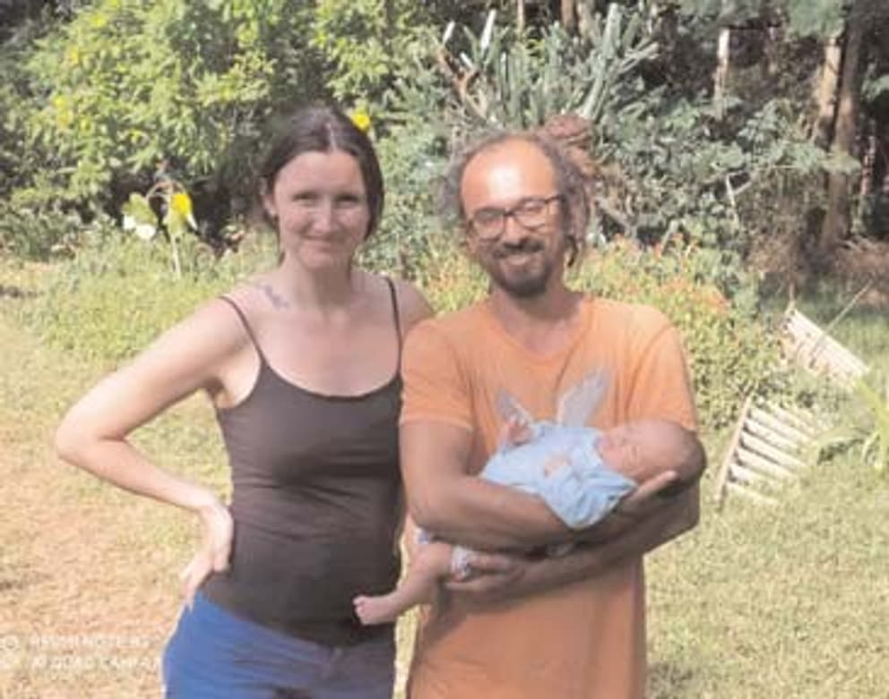Georgia and Samrat and their son, River